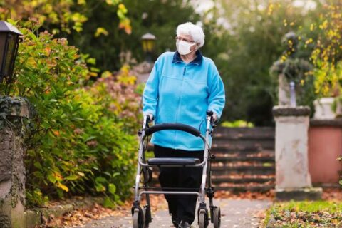 Old women walking in garden