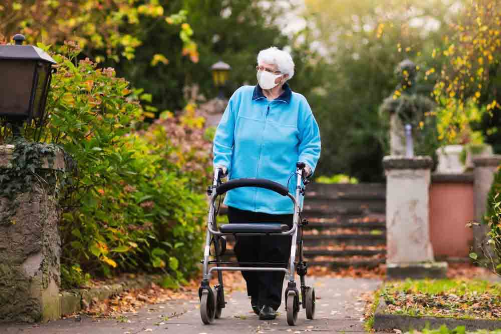 Old women walking in garden